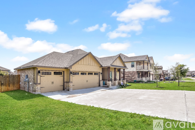 A house with a brown roof and a white garage door.