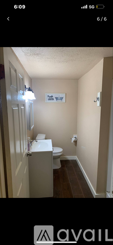 A bathroom with a toilet and sink.