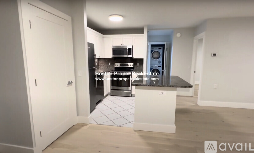 A kitchen area with a countertop and a sink.