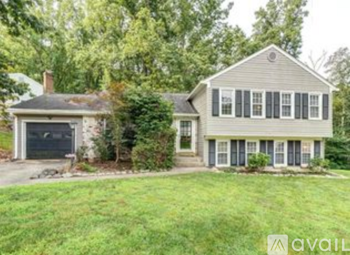 A house with a garage is for sale.