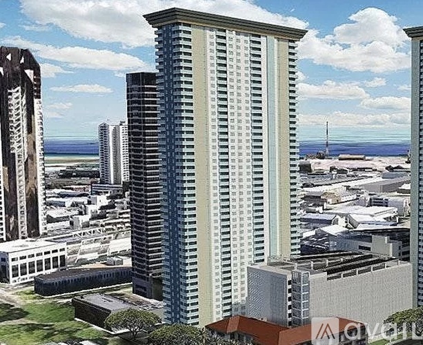 A tall building with a lot of windows stands in the middle of a city.