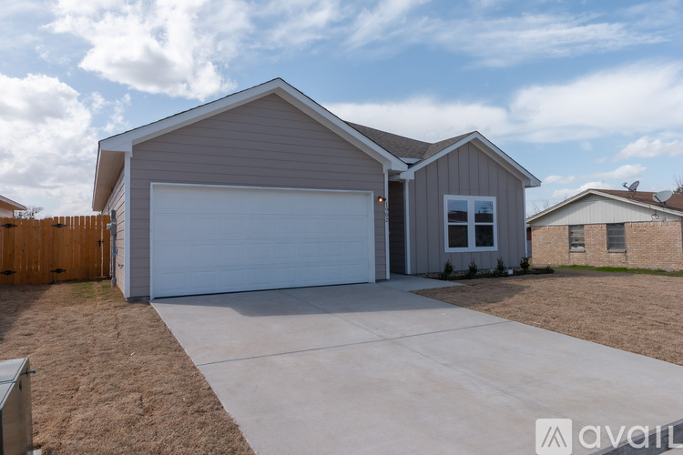 A two-car garage is attached to a house.