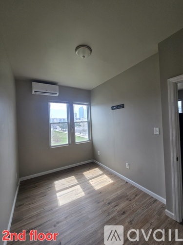A room with a window and a door is labeled as the second floor.