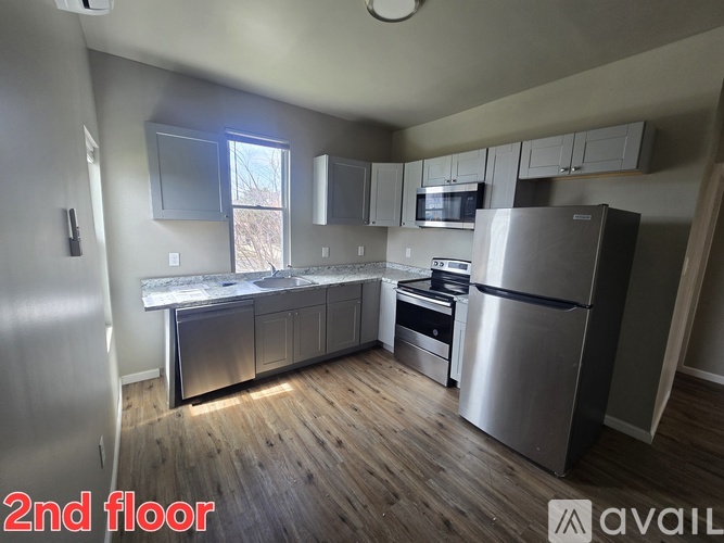 A kitchen with stainless steel appliances on the second floor.