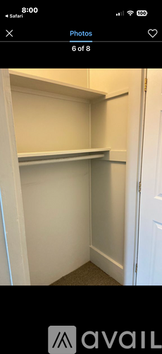 A white door is open to a white interior.