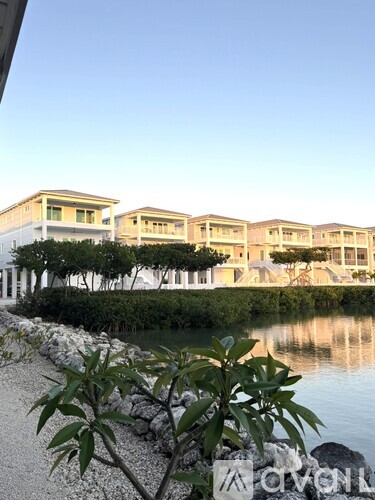 A building with a body of water in front of it.