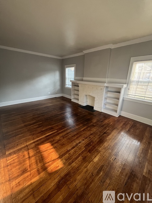 A room with wooden floors and white walls.