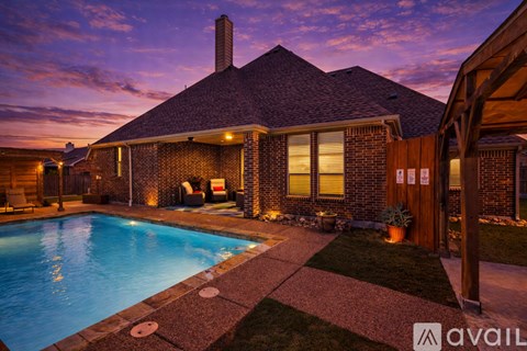 A house with a pool in the backyard.