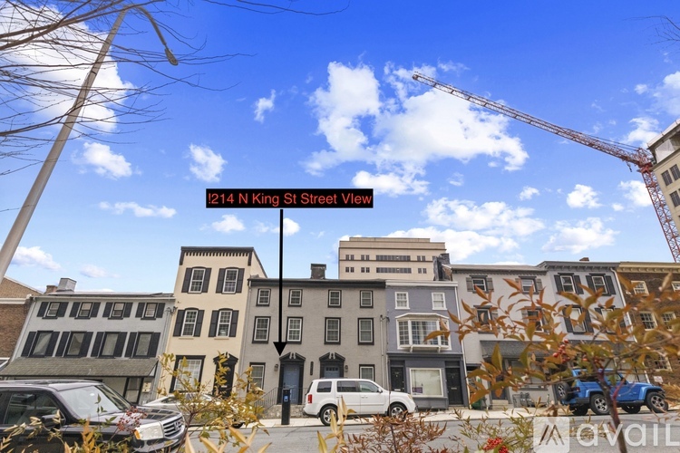 A street view with a sign that reads "214 N King St Street View".