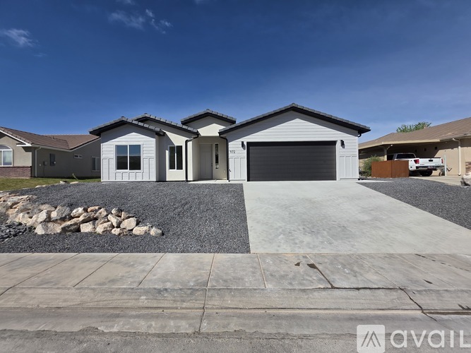 A house with a garage is available for sale.