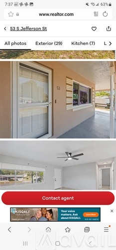 A real estate website is open on a phone screen, showing a property listing for 53 S Jefferson St with options to view all photos, the exterior, or the kitchen.