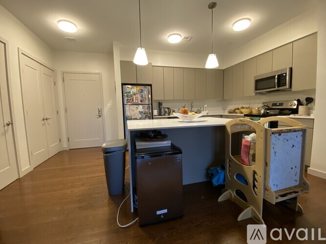 A kitchen with a dining table and chairs.
