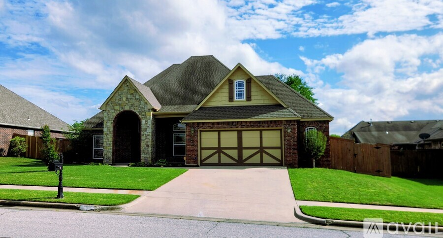 A house with a brown roof and a garage door.