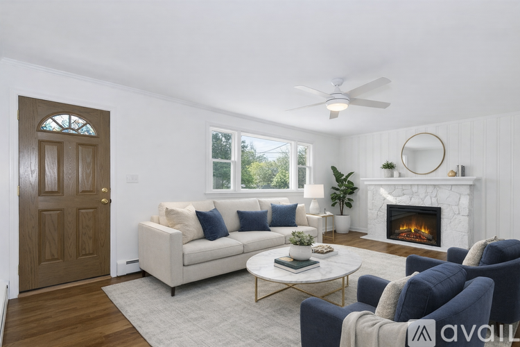 A living room with a fireplace and a couch.