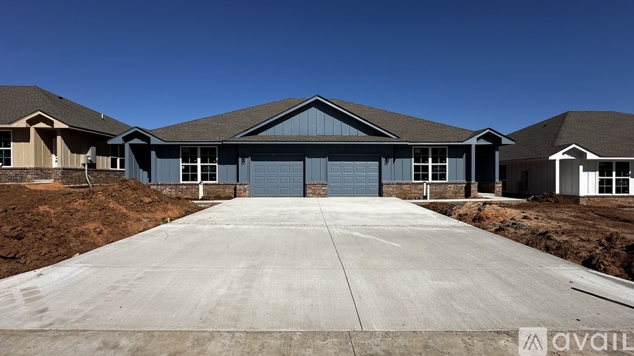 A large house with a driveway in front of it.