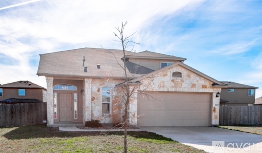A house with a brown garage door and a brown wall.