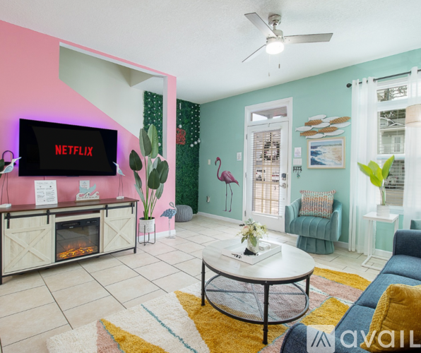 A living room with a TV displaying the Netflix logo.
