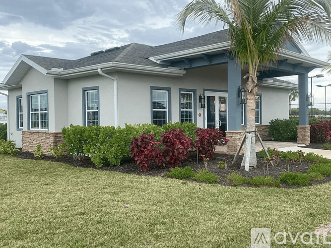 A house with a palm tree in front of it.