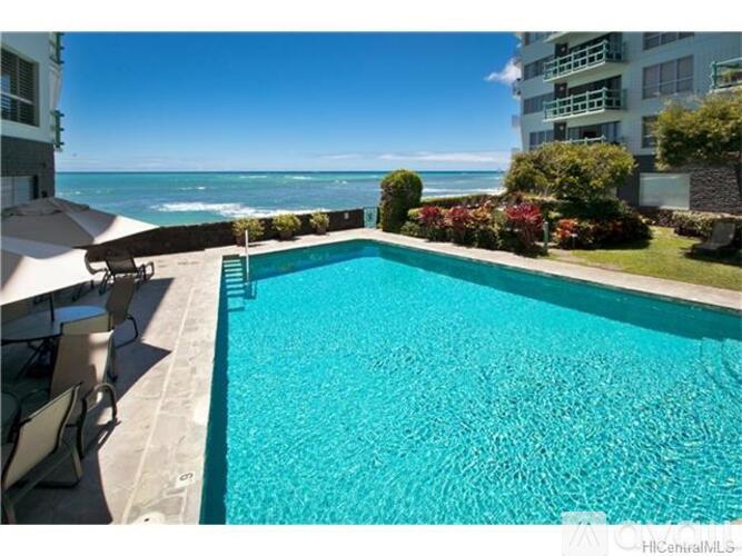 A swimming pool with a view of the ocean.