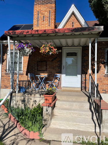 A house with a white door and a small porch.
