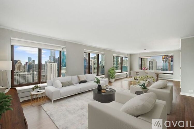 A modern living room with a large window overlooking the city.