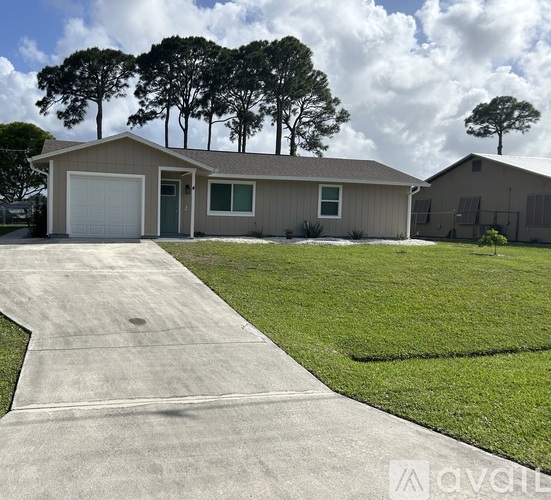 A house with a driveway in front of it.