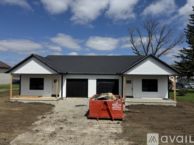 A house under construction with a sign that says "SKILLET" on it.