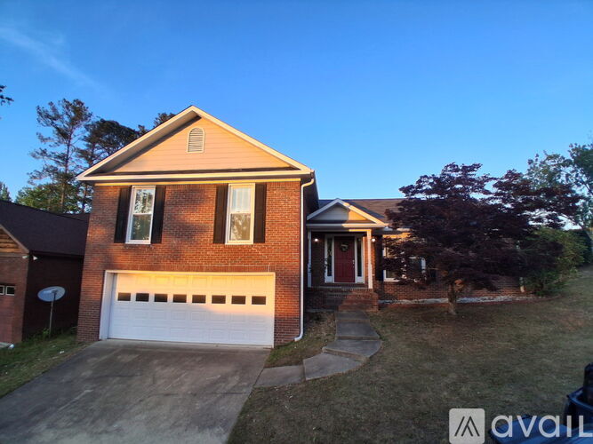 A house with a garage is available for sale.