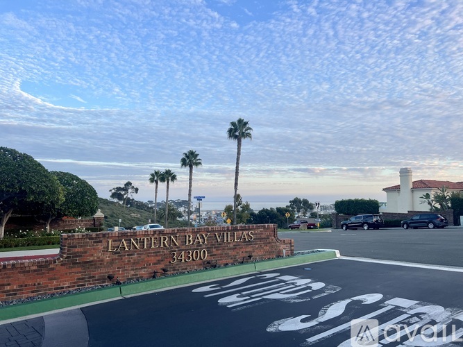A street view of a sign that says Lantern Bay Villas.