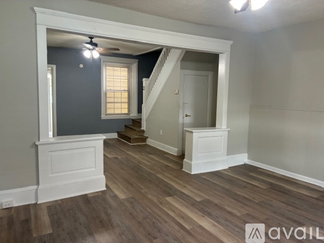 A room with a staircase leading to the second floor.