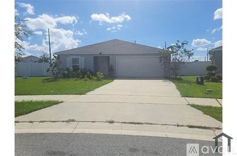 A house with a driveway in front of it.