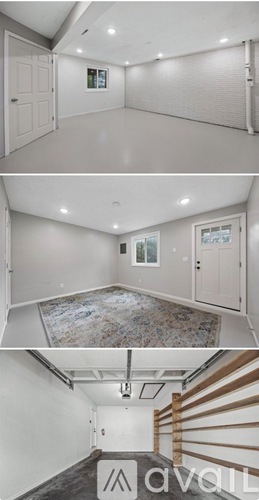 A room with a rug and a staircase.