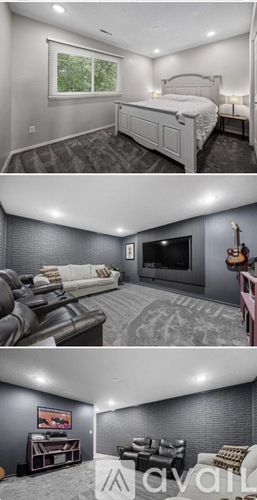 A bedroom with a large bed, a couch, and a television in a living room.