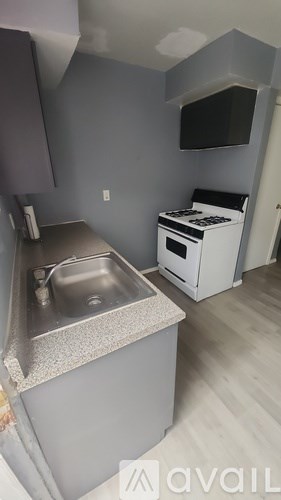 A kitchen with a sink and a dishwasher.