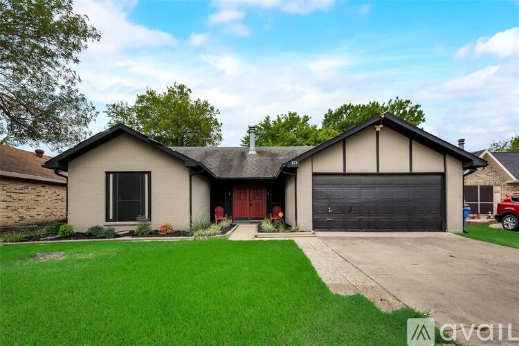 A house with a red garage door is for sale.