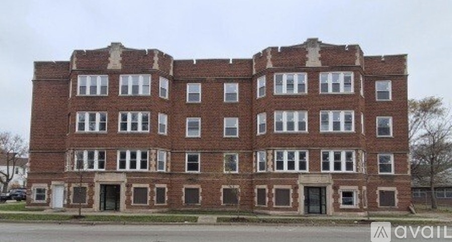 A large, old brick building with many windows is available for purchase.