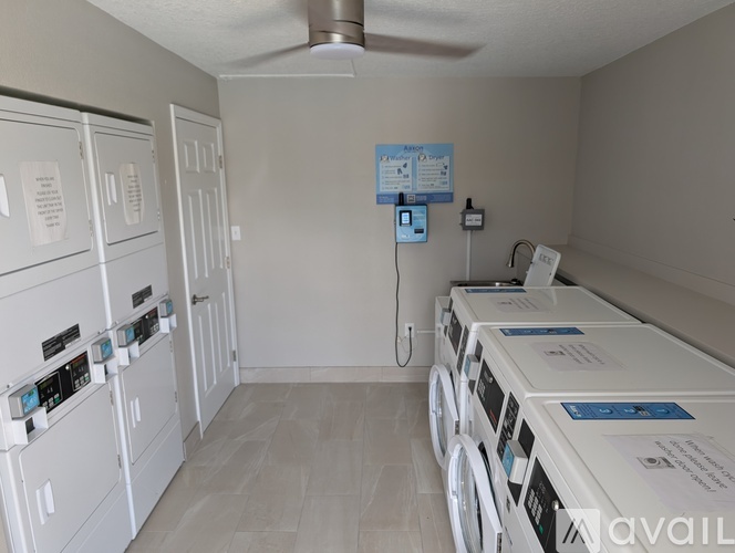 A row of washing machines in a laundromat.