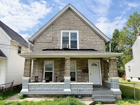 A house with a white door and a porch.