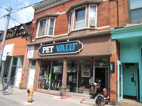 A pet store with a blue sign on the front.