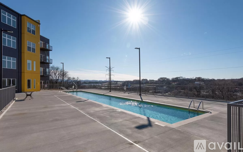 A sunny day at the outdoor pool of an apartment complex.