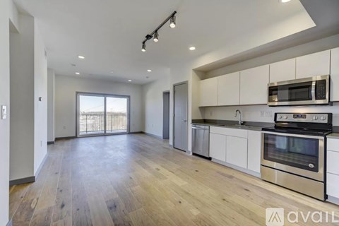 A kitchen with a stove top oven and microwave.