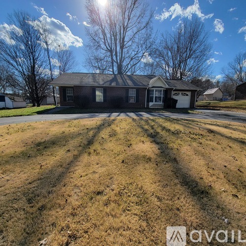 A house with a lawn in front of it is for sale.