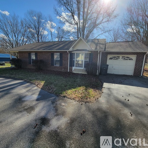 A house with a driveway in front of it.