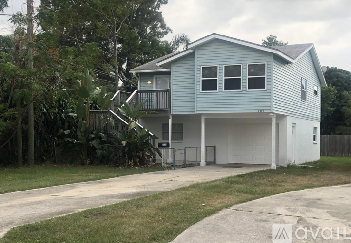A two-story house with a garage on the ground floor.