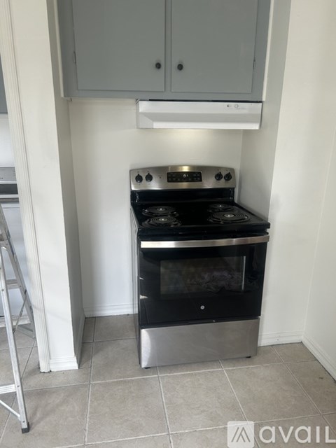 A modern kitchen with a stove and oven.