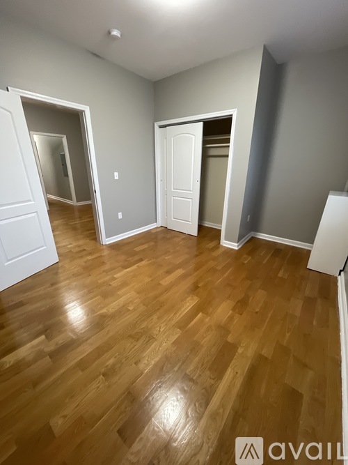 A room with wooden floors and white walls.