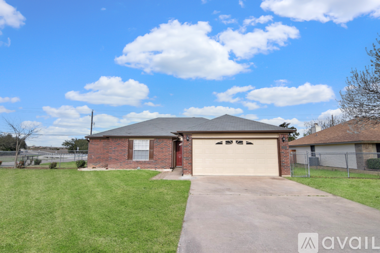 A house with a garage is available for sale.