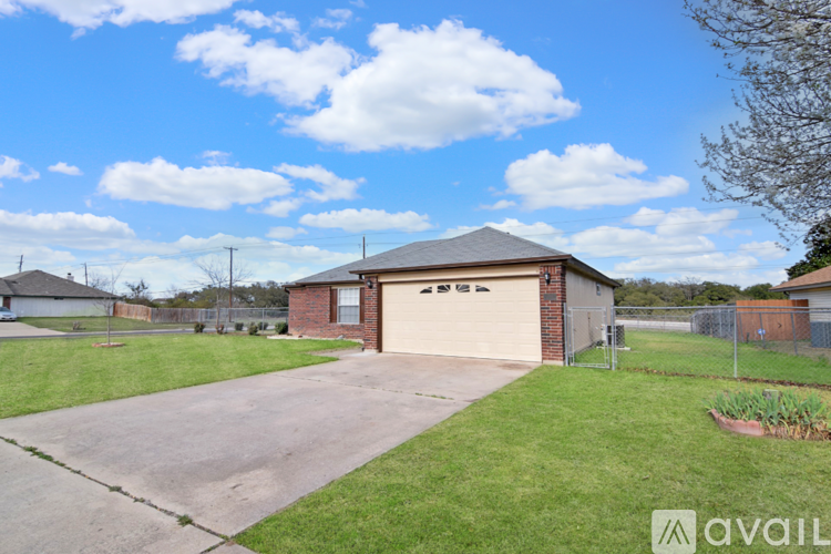 A house with a garage is for sale.
