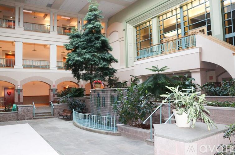 A large atrium with a Christmas tree in the center.