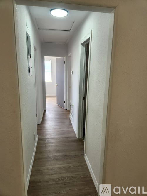 A long hallway with doors on both sides.
